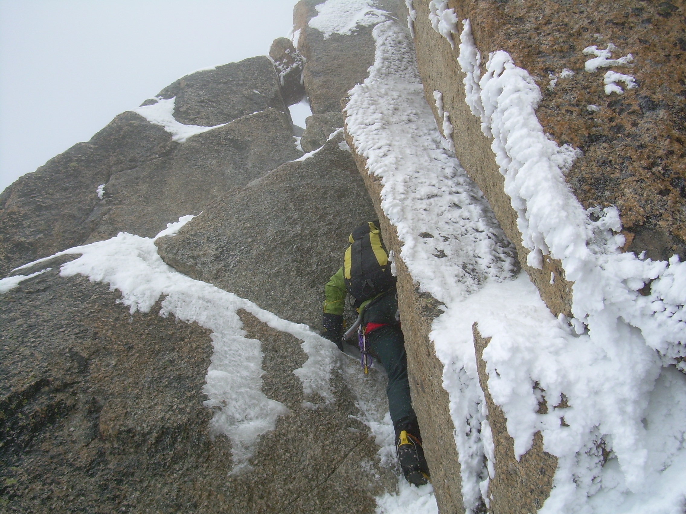 Remy clambering up last section of Cosmiques Arete.JPG